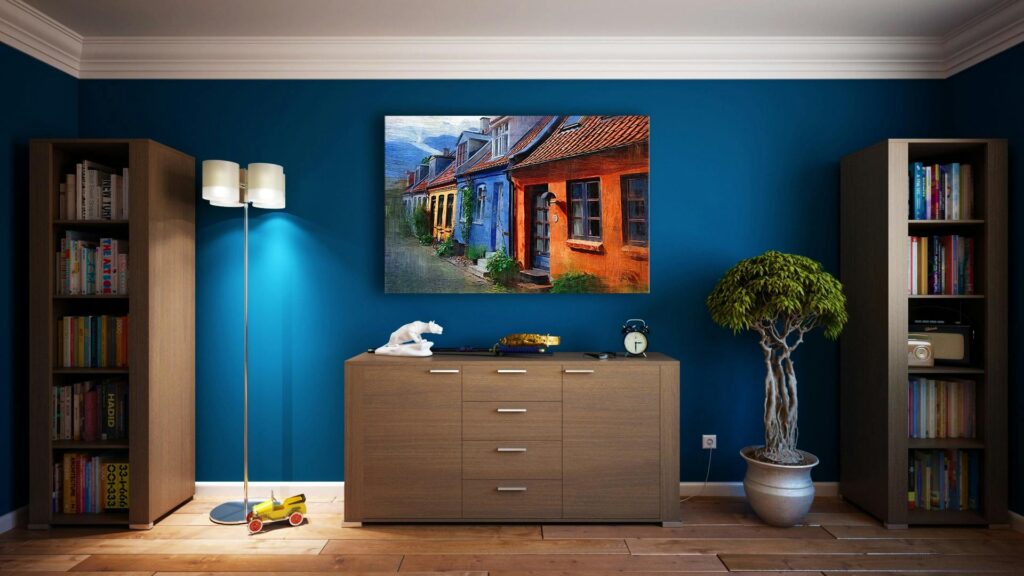pexels-photo-271816-271816 A modern living room featuring stylish bookshelves, a vibrant painting, and minimalistic decor.